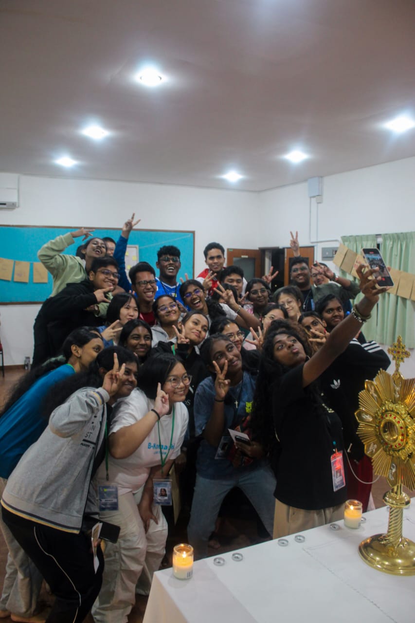 Group selfie in front of the monstrance
